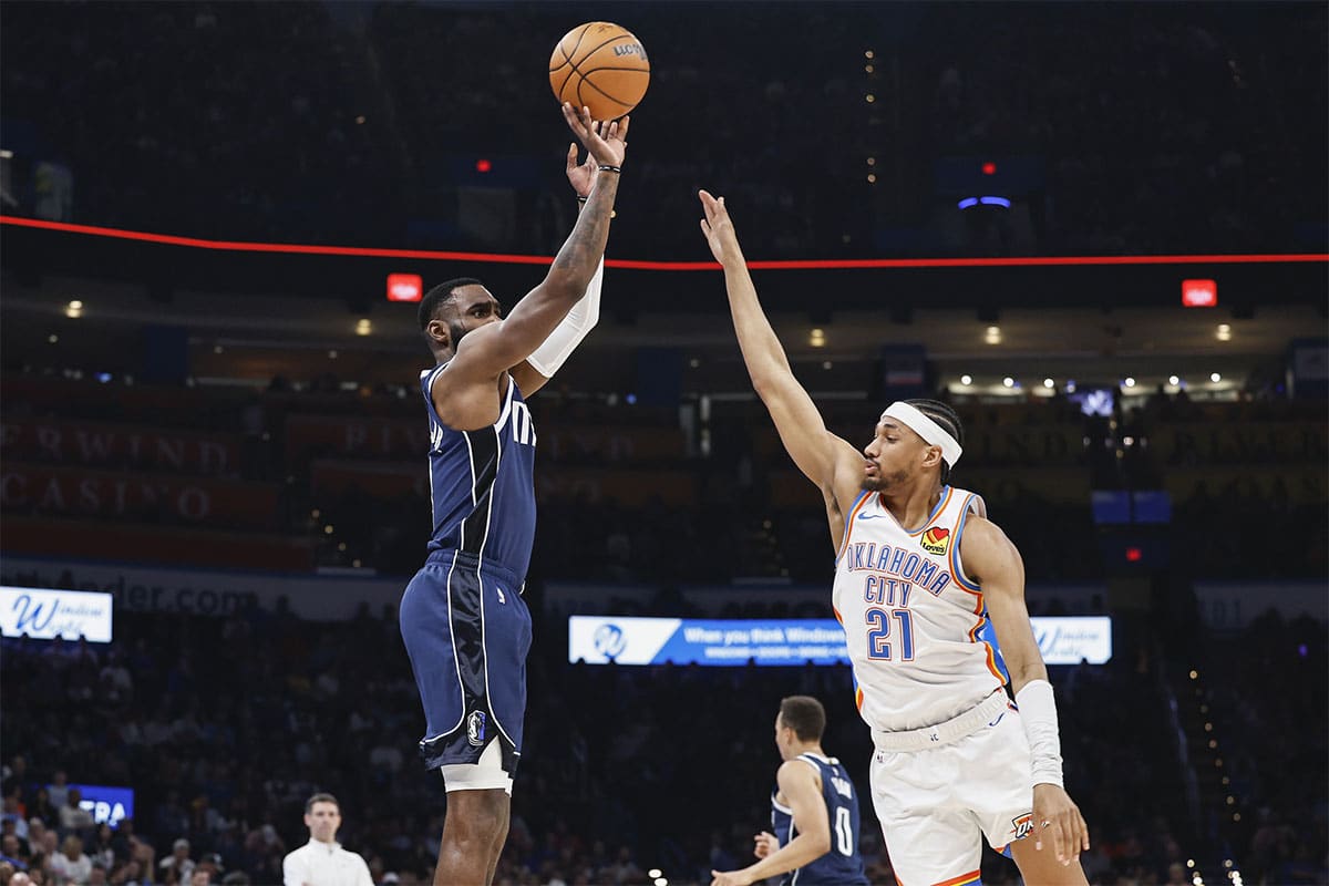 Dallas Mavericks forward Tim Hardaway Jr. (10) shoots a three point basket as Oklahoma City Thunder guard Aaron Wiggins (21) defends during the first half at Paycom Center.