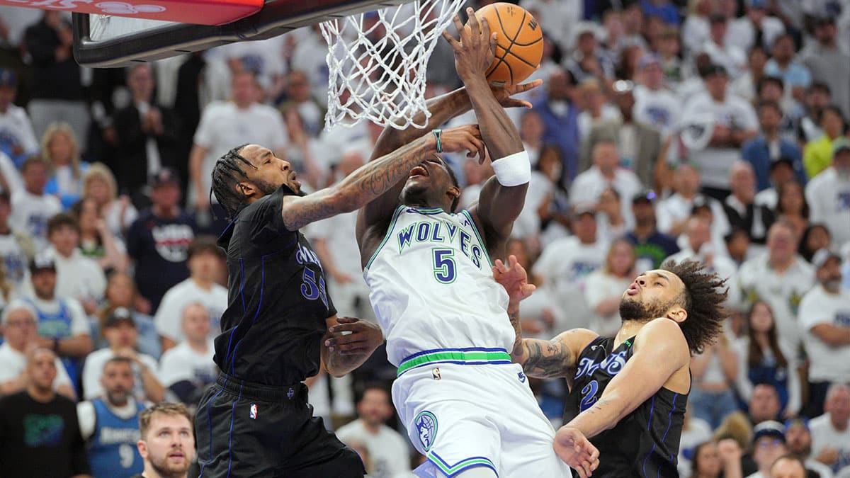 Timberwolves guard Anthony Edwards (5) shoots against Dallas Mavericks forward Derrick Jones Jr. (55) in the fourth quarter during game two of the western conference finals for the 2024 NBA playoffs at Target Center. 