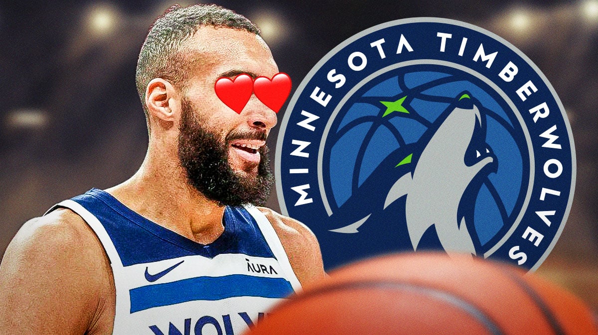 Rudy Gobert with heart eyes looking at a Timberwolves logo