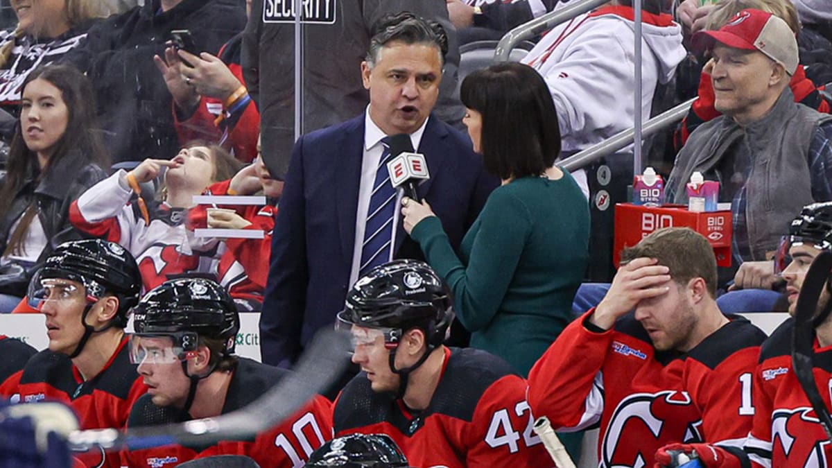 New Jersey Devils interim head coach Travis Green talks with ESPN reporter Leah Hextall during the first period of the NHL against the St. Louis Blues at Prudential Center.