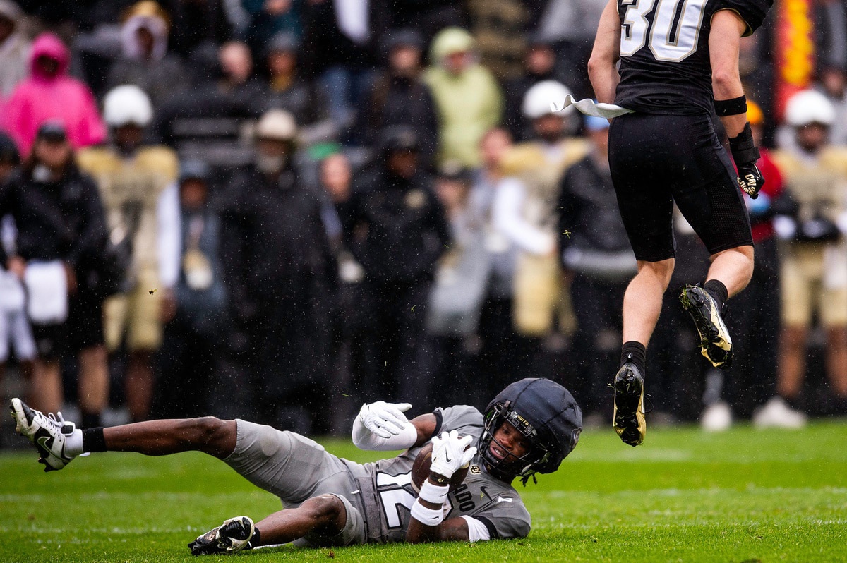 Caption:Colorado's Travis Hunter makes a catch for a first down during a Colorado football spring game at Folsom Field 