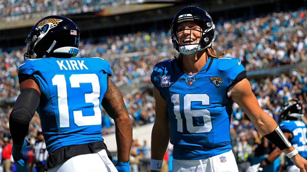 Jacksonville Jaguars quarterback Trevor Lawrence (16) celebrates his pass for a touchdown score to wide receiver Christian Kirk (13) during the second quarter of an NFL football matchup Sunday, Oct. 15, 2023 at EverBank Stadium in Jacksonville, Fla. The Jacksonville Jaguars defeated the Indianapolis Colts 37-20.