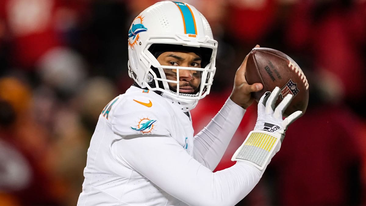 Miami Dolphins quarterback Tua Tagovailoa (1) throws a pass during the second half of a 2024 AFC wild card game against the Kansas City Chiefs at GEHA Field at Arrowhead Stadium.