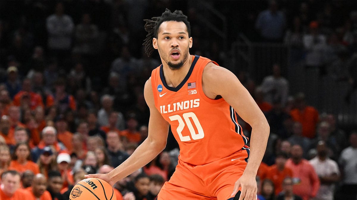 Illinois Fighting Illini forward Ty Rodgers (20) dribbles the ball against the Connecticut Huskies in the finals of the East Regional of the 2024 NCAA Tournament at TD Garden. Mandatory Credit: Brian Fluharty-USA TODAY Sportsis.