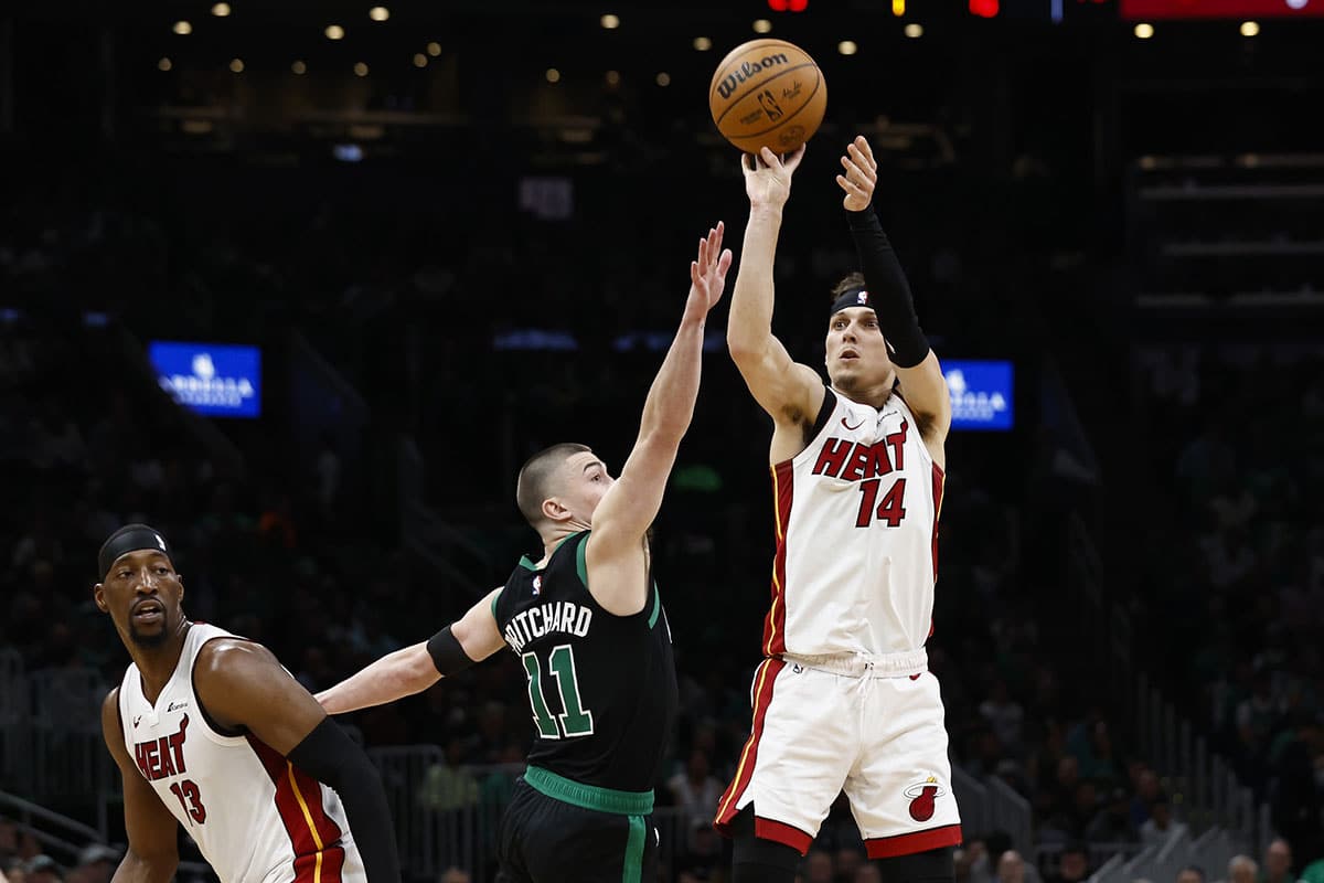 Miami Heat guard Tyler Herro (14) shoots over Boston Celtics guard Payton Pritchard (11) during the first quarter of game five of the first round of the 2024 NBA playoffs at TD Garden.