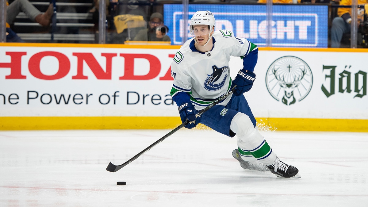 Vancouver Canucks defenseman Tyler Myers (57) skates with the puck against the Nashville Predators during the first period in game six of the first round of the 2024 Stanley Cup Playoffs at Bridgestone Arena.