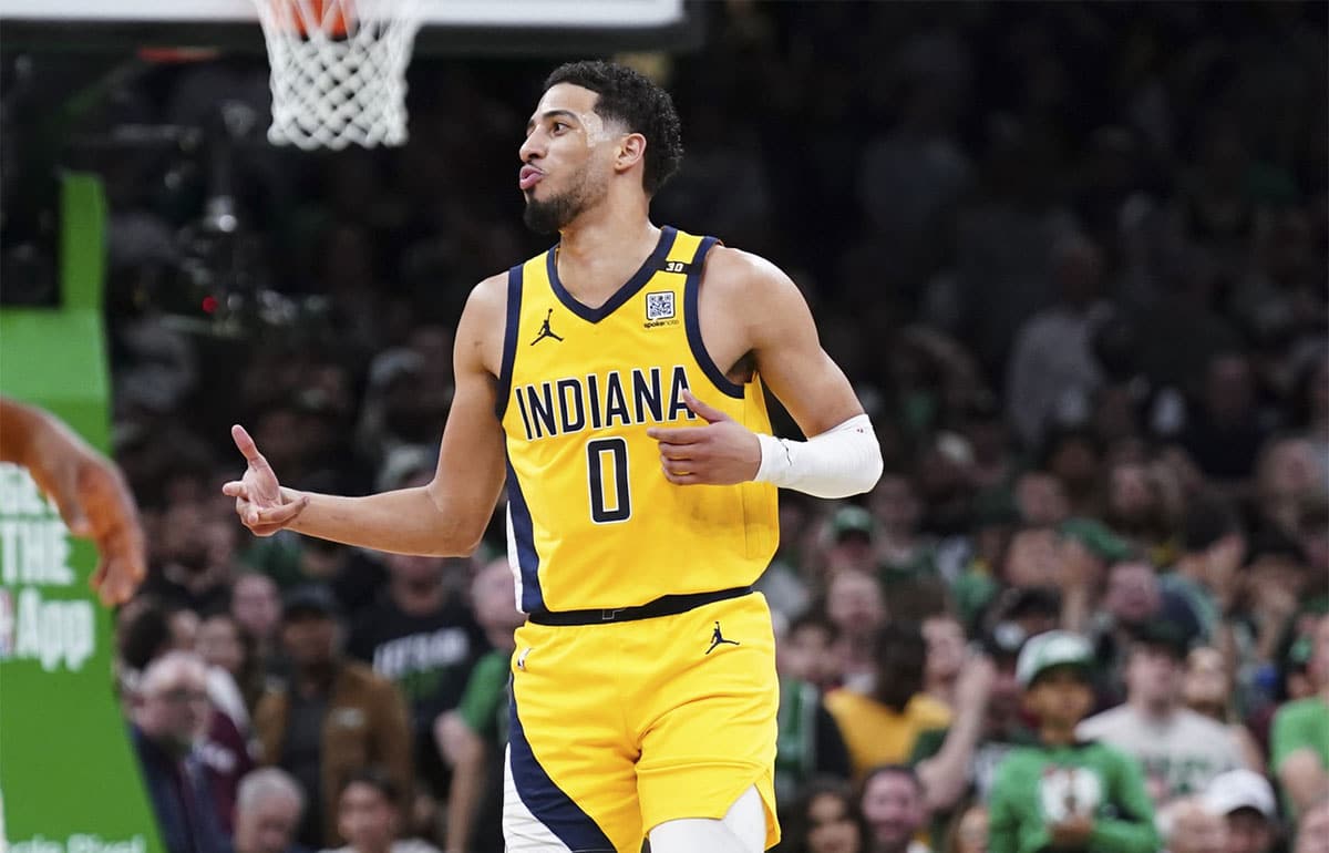 Indiana Pacers guard Tyrese Haliburton (0) reacts after his three point basket against the Boston Celtics in the second quarter during game one of the eastern conference finals for the 2024 NBA playoffs at TD Garden.