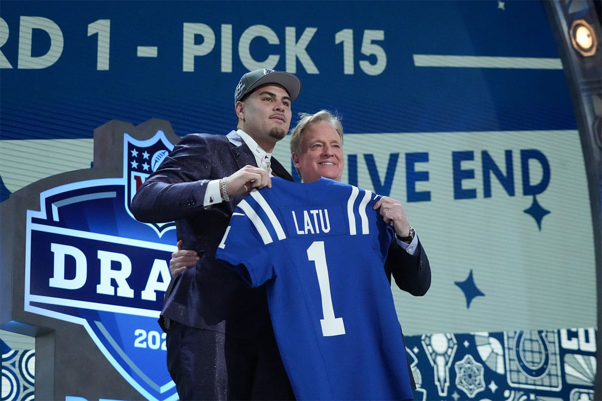 UCLA Bruins defensive lineman Laiatu Latu poses with NFL commissioner Roger Goodell after being selected by the Indianapolis Colts as the No. 15 pick in the first round of the 2024 NFL Draft