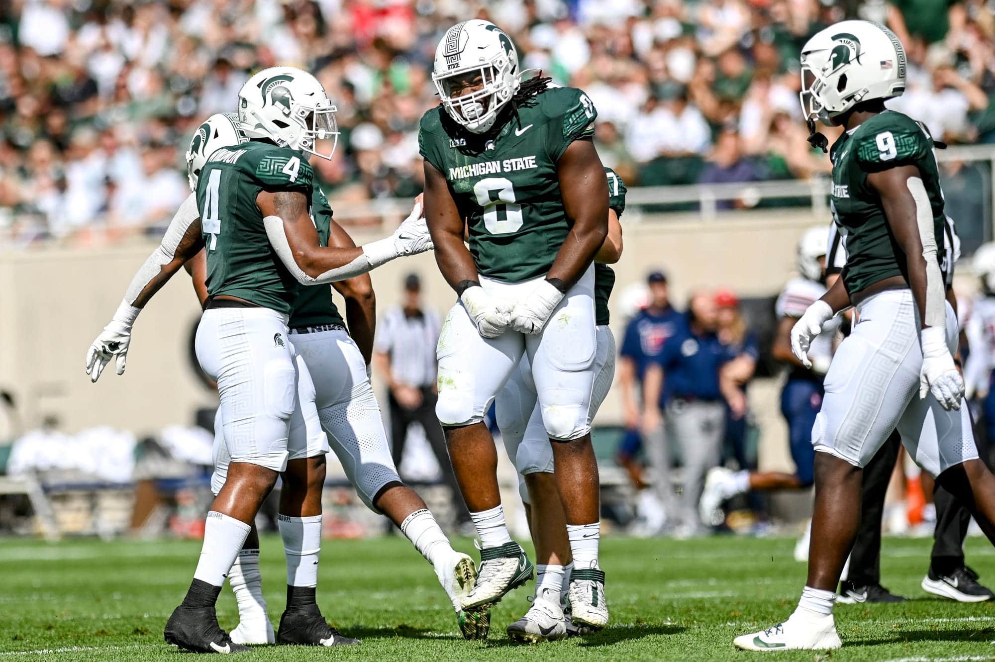 Michigan State's Simeon Barrow Jr., center, celebrates his sack against Richmond during the first quarter on Saturday, Sept. 9, 2023, at Spartan Stadium in East Lansing.