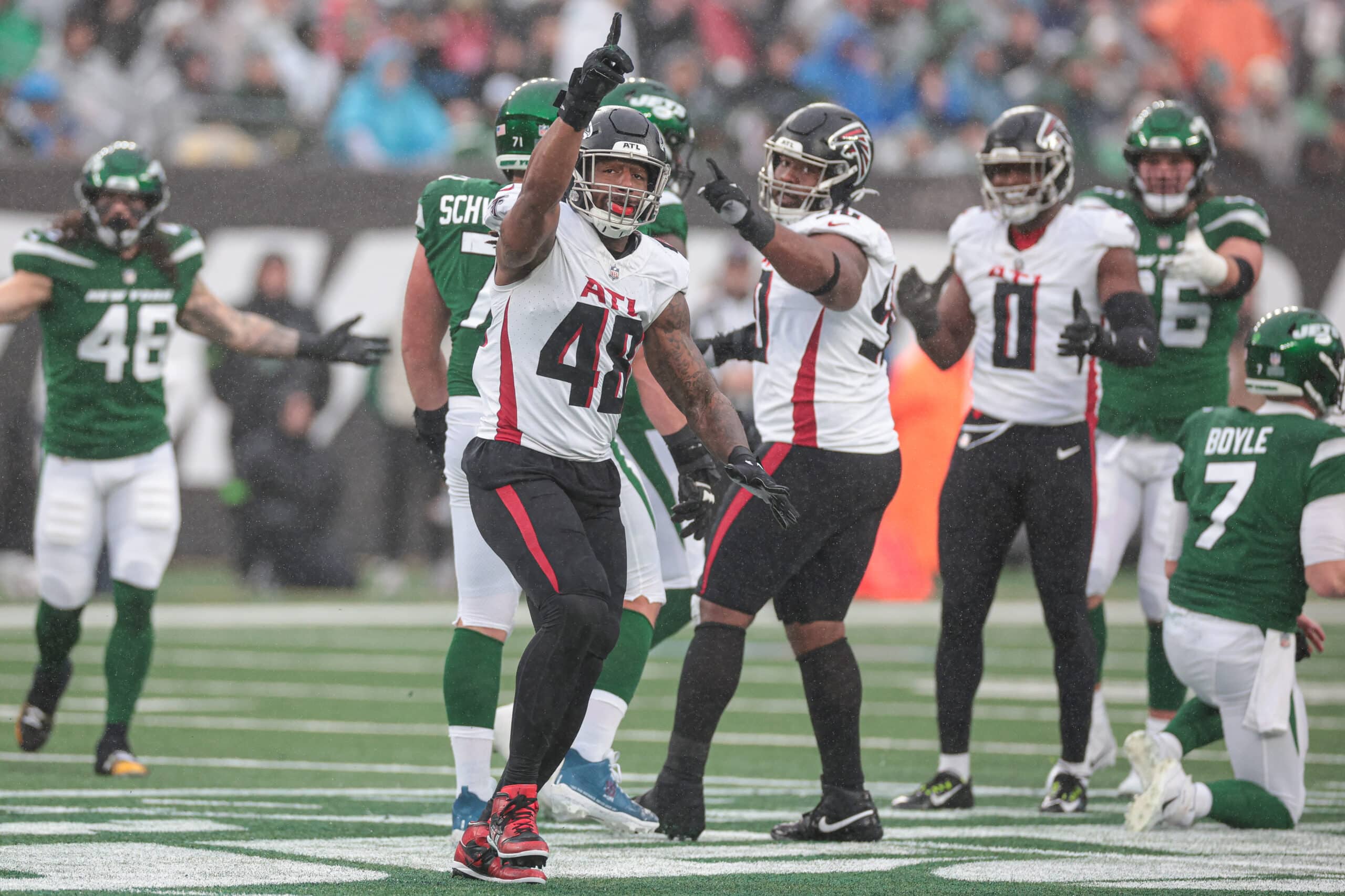 Dec 3, 2023; East Rutherford, New Jersey, USA; Atlanta Falcons linebacker Bud Dupree (48) celebrates his sack against New York Jets quarterback Tim Boyle (7) during the first half at MetLife Stadium. 