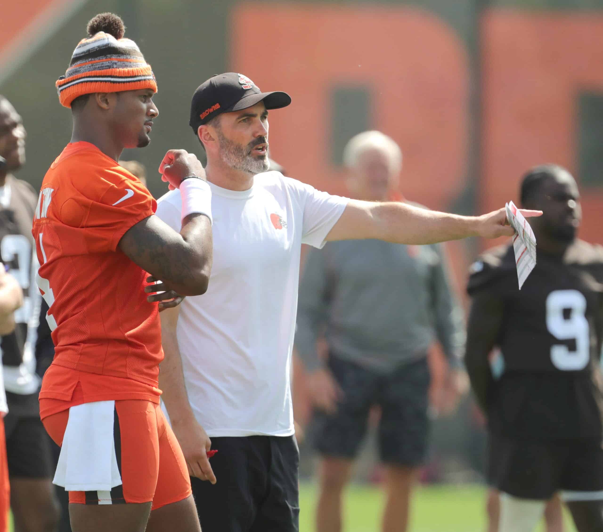 Browns quarterback Deshaun Watson talks with head coach Kevin Stefanski during a workout, Wednesday, June 8, 2022 in Berea.