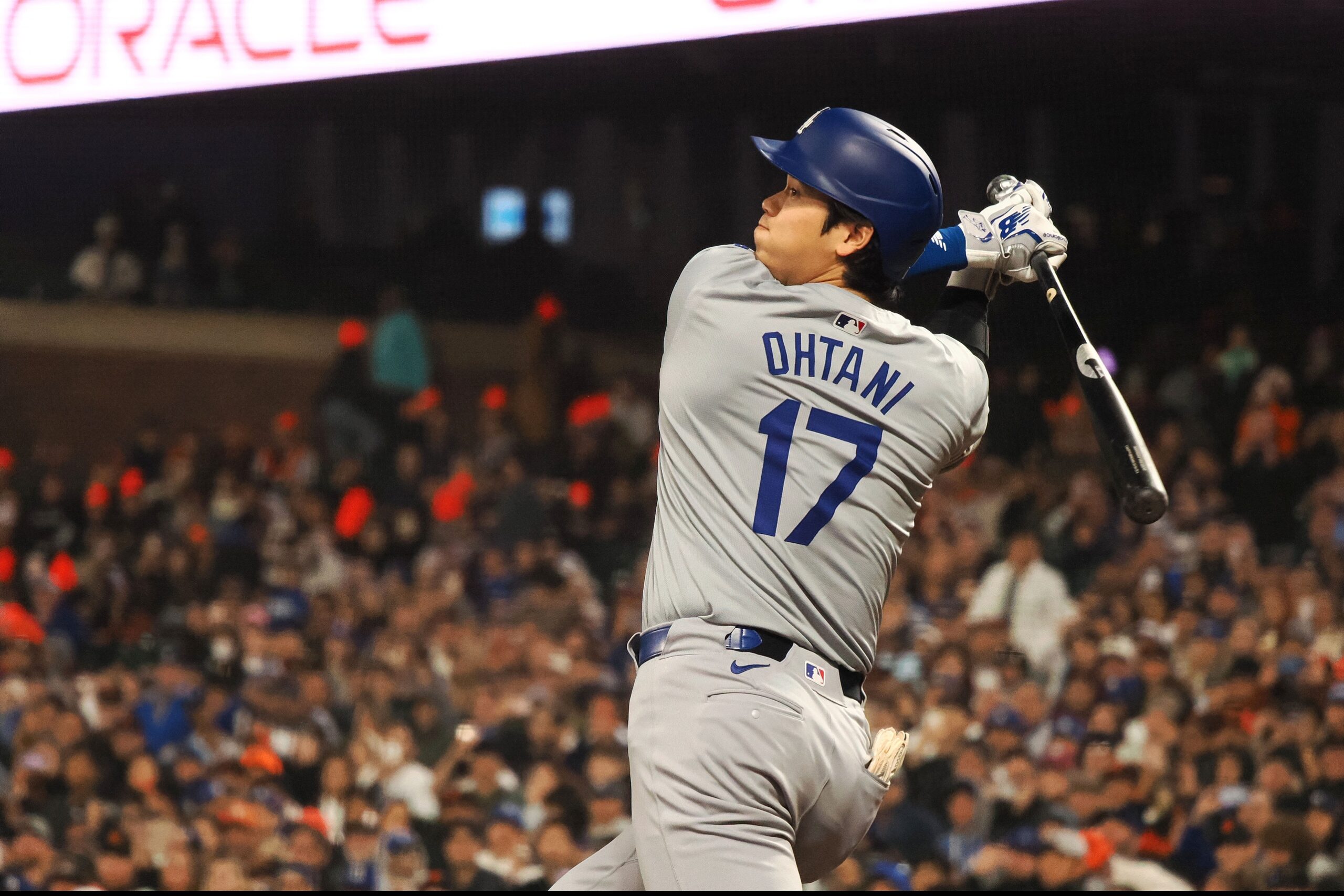 Los Angeles Dodgers designated hitter Shohei Ohtani (17) hits a RBI double against the San Francisco Giants during the seventh inning at Oracle Park.