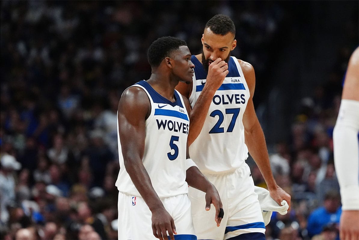 Minnesota Timberwolves guard Anthony Edwards (5) and center Rudy Gobert (27) during the second half against the Denver Nuggets during game one of the second round for the 2024 NBA playoffs at Ball Arena.