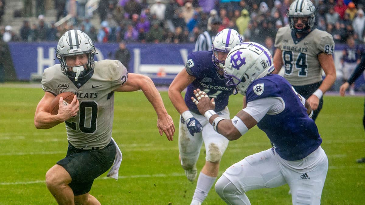 University of New Hampshire junior Dylan Laube runs against Holy Cross in the second round of the FCS playoffs, Dec. 3, 2022 in Worcester.