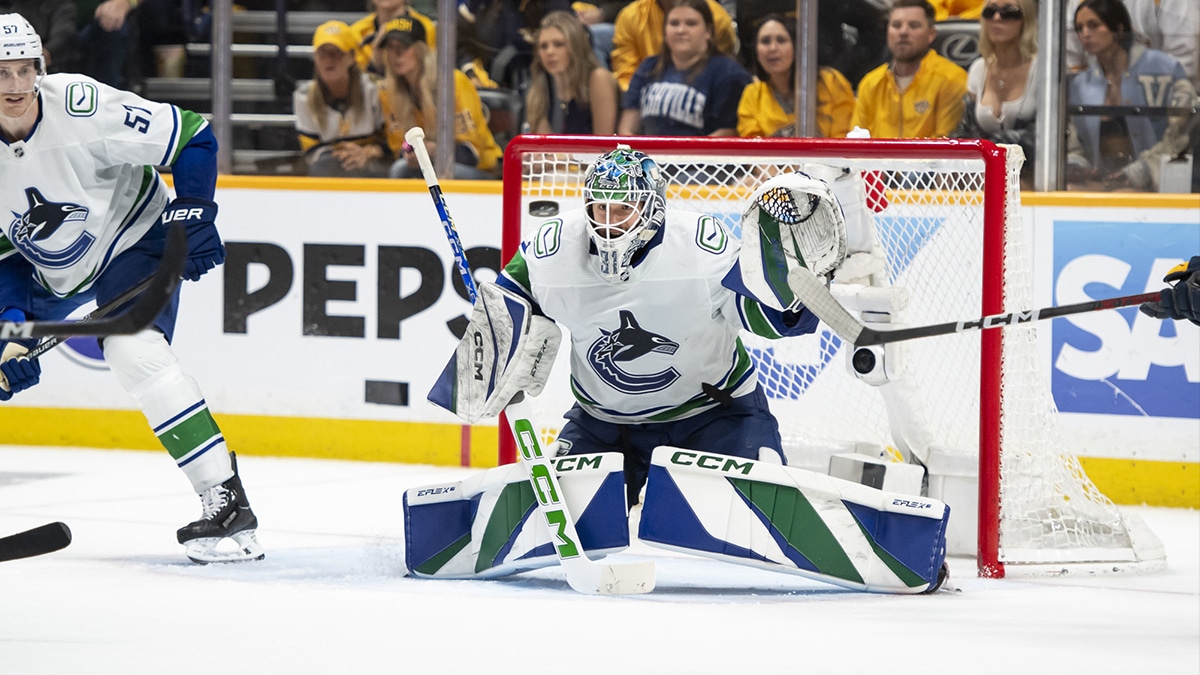 Vancouver Canucks goalkeeper Vancouver Canucks goalie Arturs Silovs (31) blocks the puck against the Nashville Predators during the third period in game six of the first round of the 2024 Stanley Cup Playoffs at Bridgestone Arena.