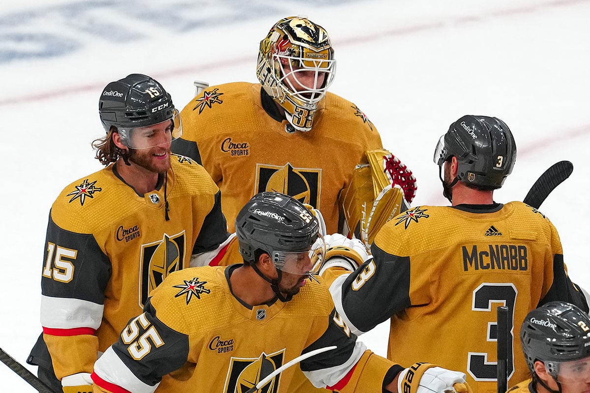 Vegas Golden Knights goaltender Adin Hill (33) celebrates with defenseman Noah Hanifin (15), defenseman Brayden McNabb (3) and right wing Keegan Kolesar (55) after defeating the Dallas Stars 2-0 in game six of the first round of the 2024 Stanley Cup Playoffs at T-Mobile Arena.