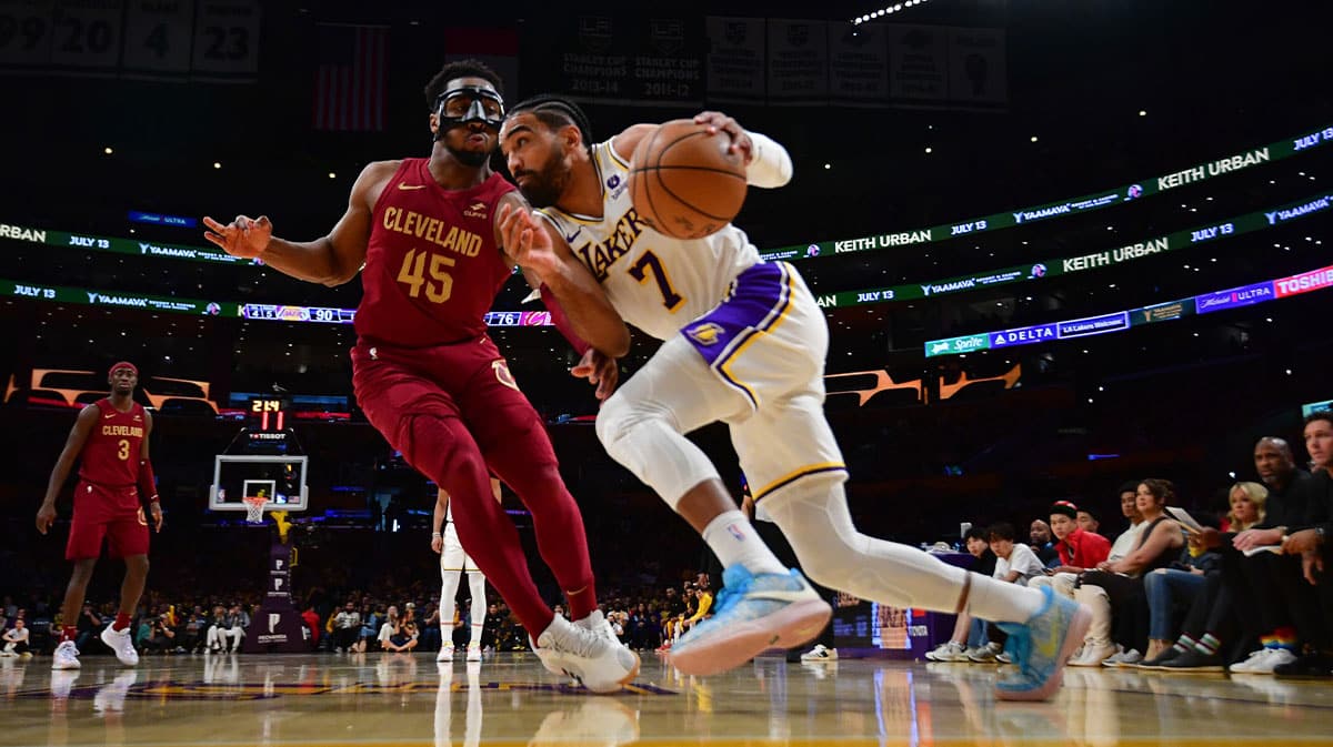 Los Angeles Lakers guard Gabe Vincent (7) moves the ball against Cleveland Cavaliers guard Donovan Mitchell (45) during the second half at Crypto.com Arena.