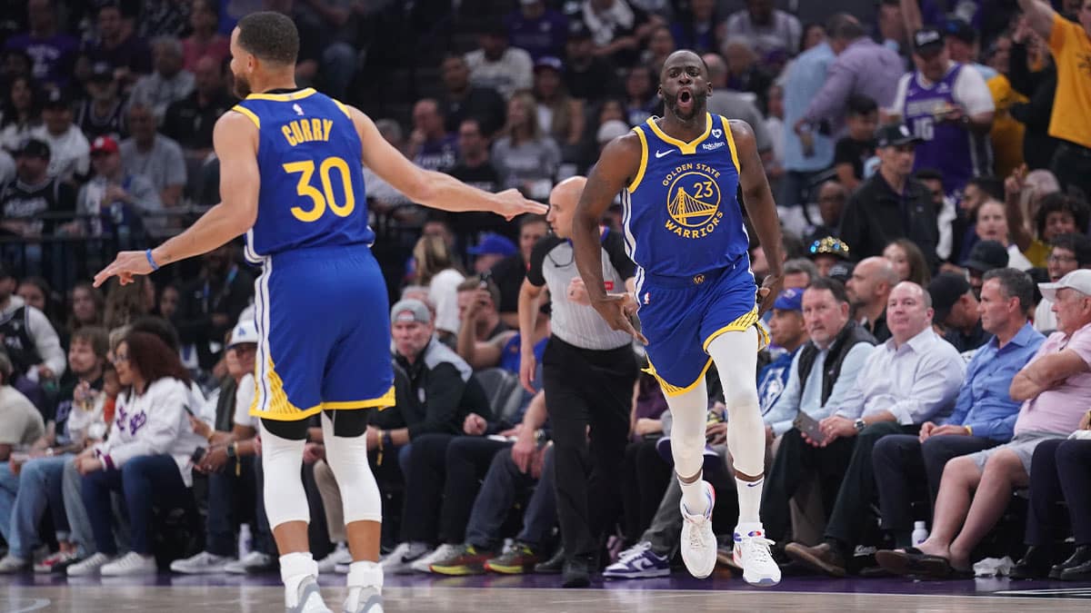 Golden State Warriors forward Draymond Green (23) reacts after making a three point basket against the Sacramento Kings in the first quarter during a play-in game of the 2024 NBA playoffs at the Golden 1 Center.
