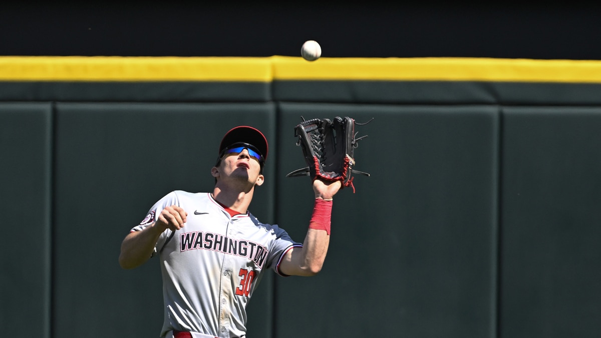Washington Nationals outfielder Jacob Young (30) catches a fly ball hit by Chicago White Sox first baseman Andrew Vaughn (not shown) during the eighth inning at Guaranteed Rate Field.