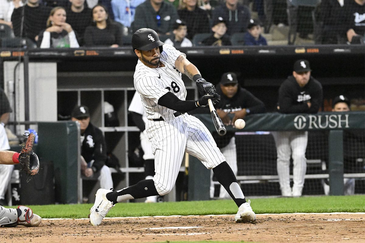 Chicago White Sox outfielder Tommy Pham (28) hits an RBI single against the Cleveland Guardians during the fifth inning at Guaranteed Rate Field.