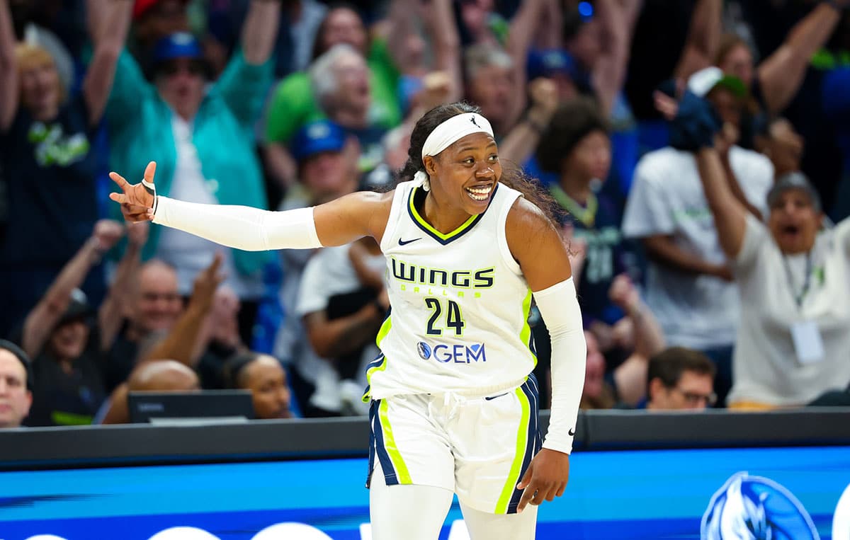 Dallas Wings guard Arike Ogunbowale (24) reacts after scoring during the fourth quarter against the Chicago Sky.