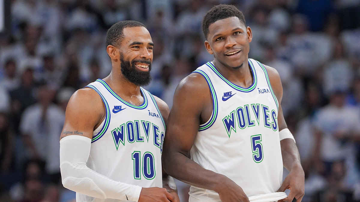 Timberwolves guard Mike Conley (10) and guard Anthony Edwards (5) talk against the Denver Nuggets in the fourth quarter during game six of the second round for the 2024 NBA playoffs at Target Center.