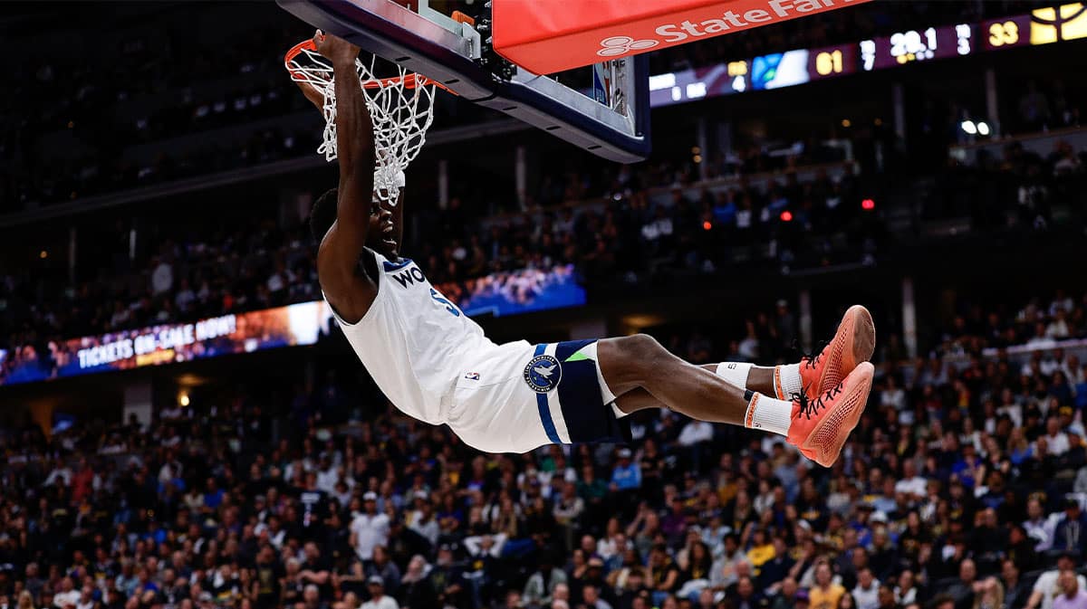 innesota Timberwolves guard Anthony Edwards (5) dunks the ball in the second quarter against the Denver Nuggets during game two of the second round for the 2024 NBA playoffs at Ball Arena.