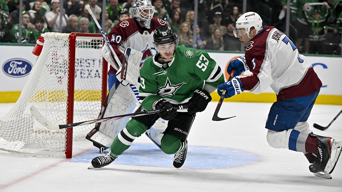Dallas Stars center Wyatt Johnston (53) chases the puck past Colorado Avalanche defenseman Jack Johnson (3) during the overtime period in game one of the second round of the 2024 Stanley Cup Playoffs at American Airlines Center.