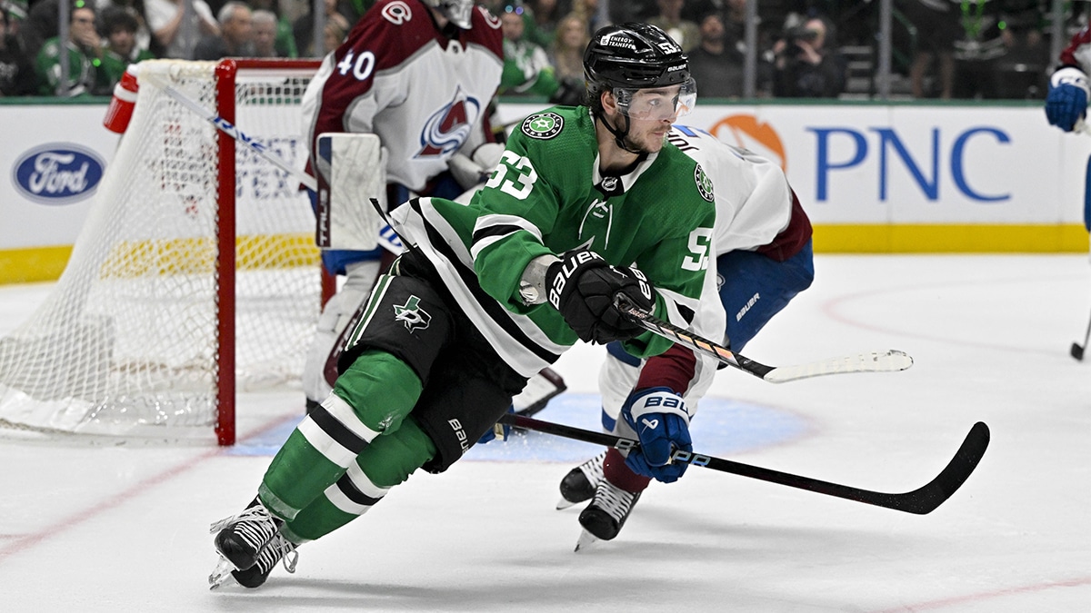 Dallas Stars center Wyatt Johnston (53) chases the puck past Colorado Avalanche defenseman Jack Johnson (3) during the overtime period in game one of the second round of the 2024 Stanley Cup Playoffs at American Airlines Center. 