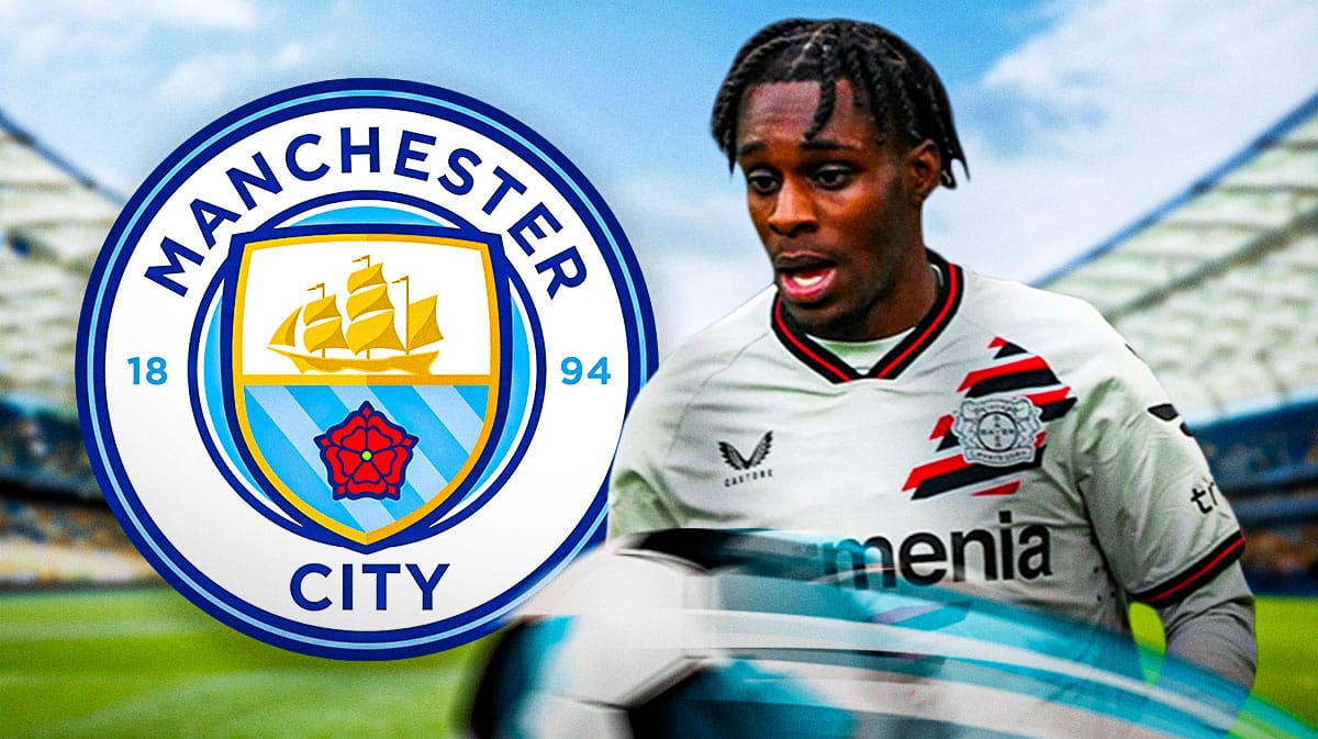 Jeremie Frimpong in front of the Manchester City logo