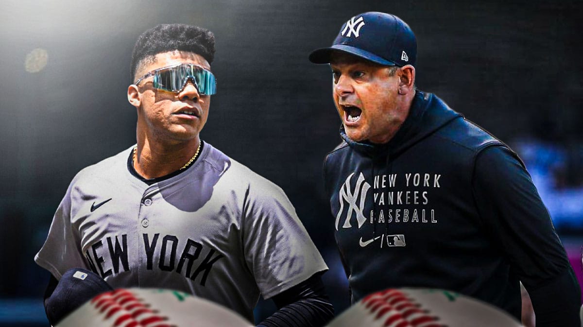 New York Yankees manager Aaron Boone next to Juan Soto
