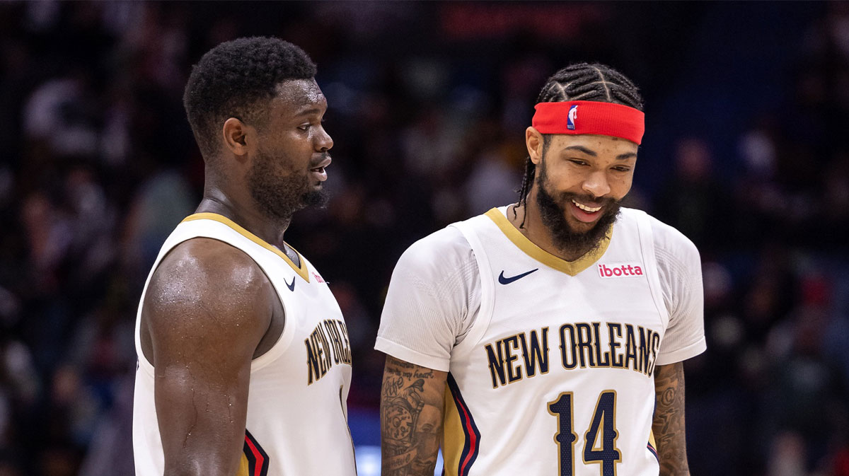 New Orleans Pelicans forward Zion Williamson (1) and forward Brandon Ingram (14) share a laugh after a play against the Los Angeles Lakers during the second half at Smoothie King Center.