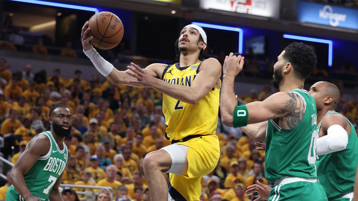 May 25, 2024; Indianapolis, Indiana, USA; Indiana Pacers guard Andrew Nembhard (2) shoots the ball against Boston Celtics guard Jaylen Brown (7) and forward Jayson Tatum (0) and center Al Horford (42) during the first quarter of game three of the eastern conference finals in the 2024 NBA playoffs at Gainbridge Fieldhouse. Mandatory Credit: Trevor Ruszkowski-USA TODAY Sports