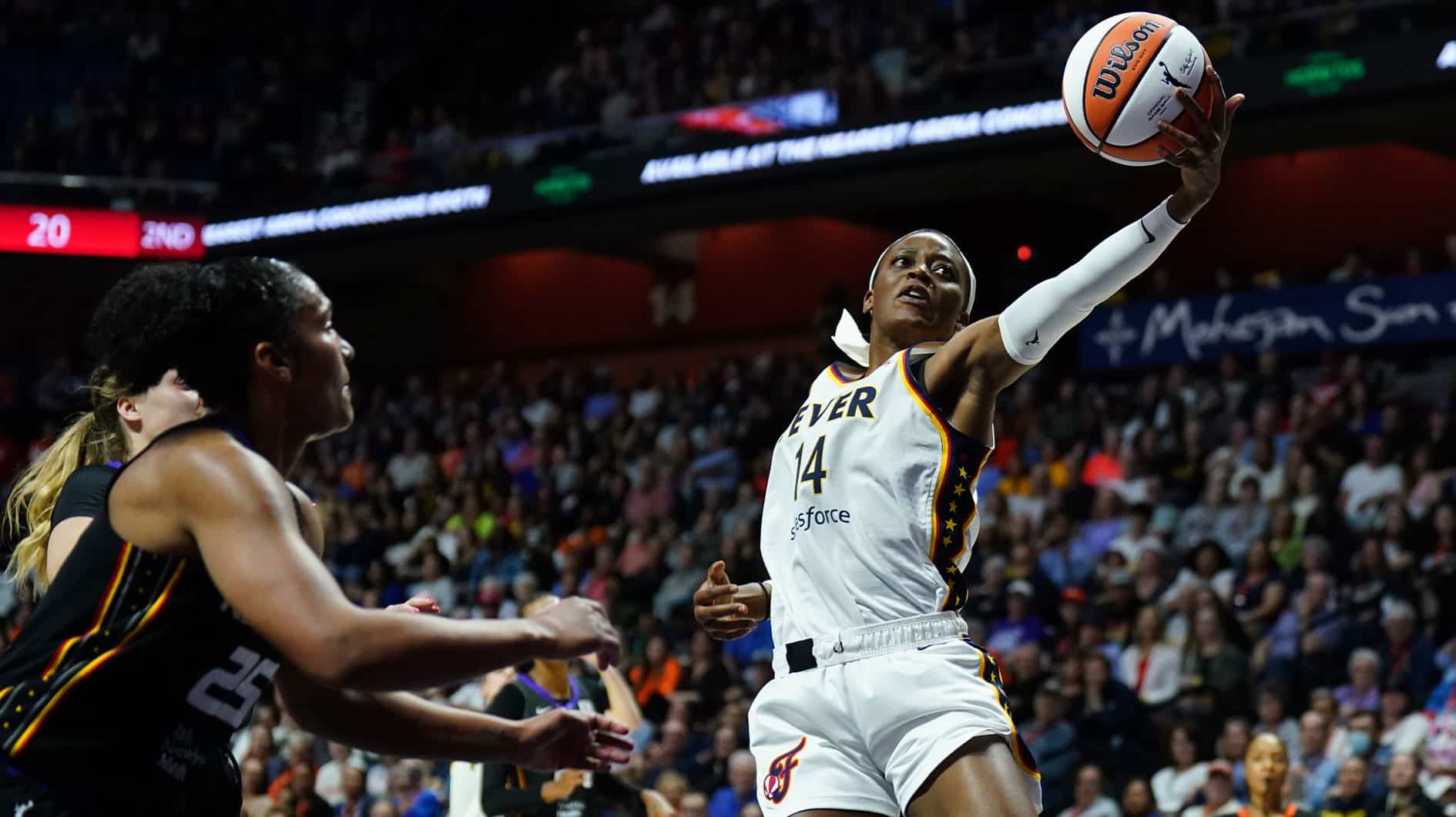 Indiana Fever center Temi Fagbenle (14) tries to grab a pass against the Connecticut Sun in the second quarter at Mohegan Sun Arena.