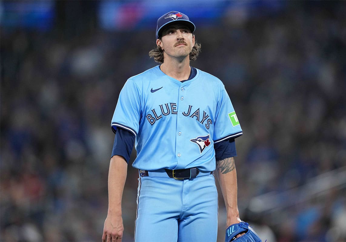Toronto Blue Jays starting pitcher Kevin Gausman (34) walks towards the dugout against the Minnesota Twins during the first inning at Rogers Centre.