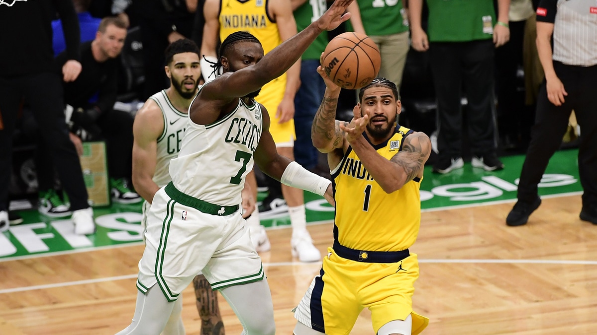 May 21, 2024; Boston, Massachusetts, USA; Indiana Pacers forward Obi Toppin (1) passes the ball against Boston Celtics guard Jaylen Brown (7) in overtime for game one of the eastern conference finals for the 2024 NBA playoffs at TD Garden. Mandatory Credit: Bob DeChiara-USA TODAY Sports