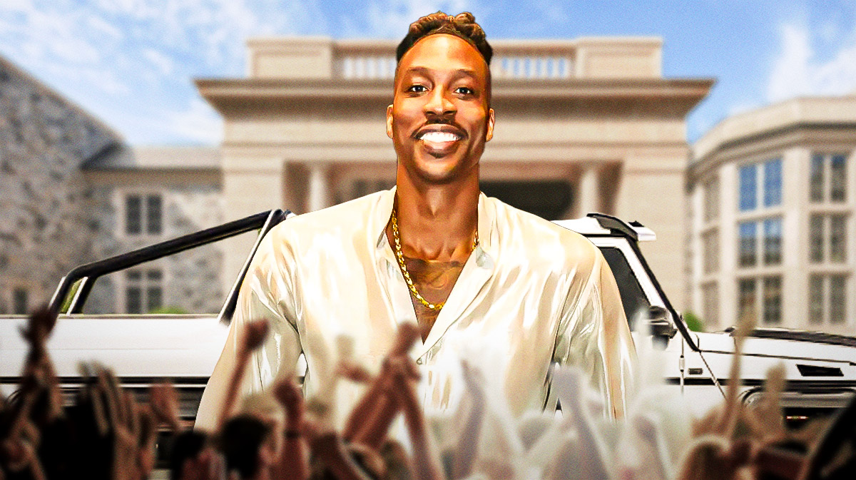 Dwight Howard in front of a car from his collection.