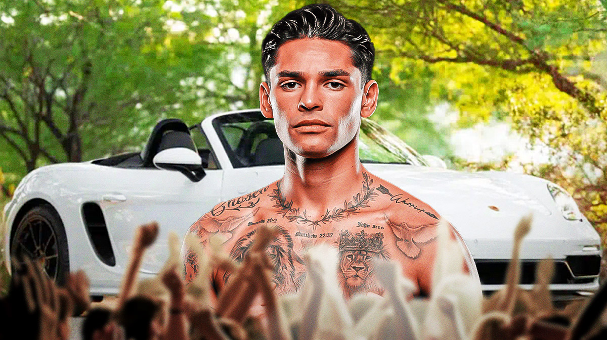 Ryan Garcia in front of a car from his collection.