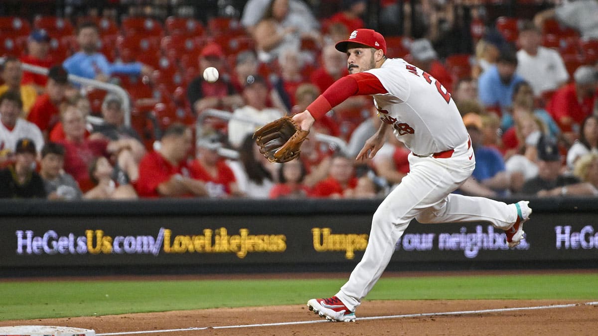 St. Louis Cardinals third baseman Nolan Arenado (28) fields a ball against the Pittsburgh Pirates during the eighth inning at Busch Stadium.
