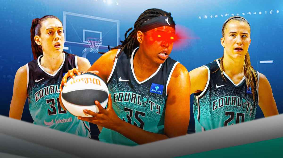 Jonquel Jones with laser eyes. Breanna Stewart and Sabrina Ionescu behind her