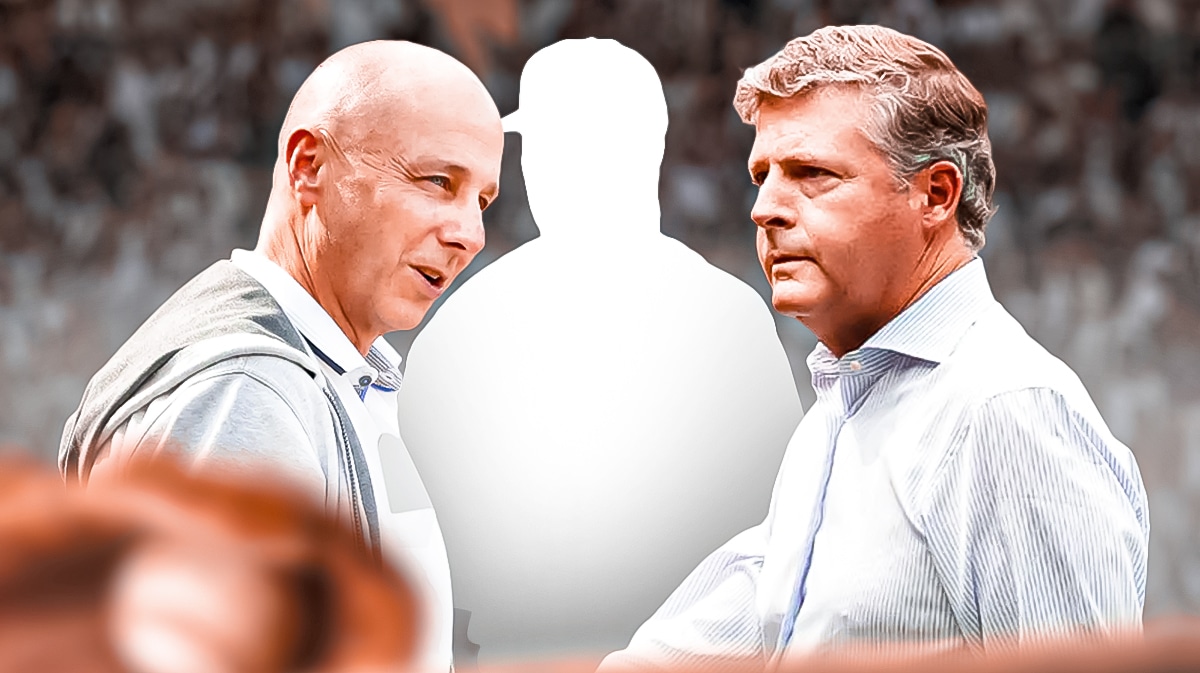 Brian Cashman and Hal Steinbrenner with mystery player silhouette. Yankee Stadium in background