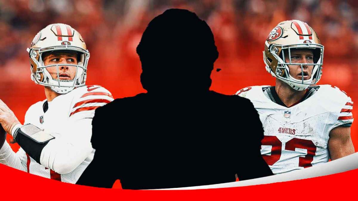 Mystery player in the middle, Brock Purdy, Christian McCaffrey around him, San Francisco 49ers wallpaper in the background
