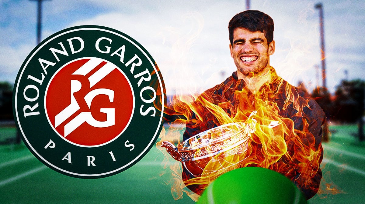 Carlos Acaraz smiles with 2024 French Open trophy after Roland Garros win
