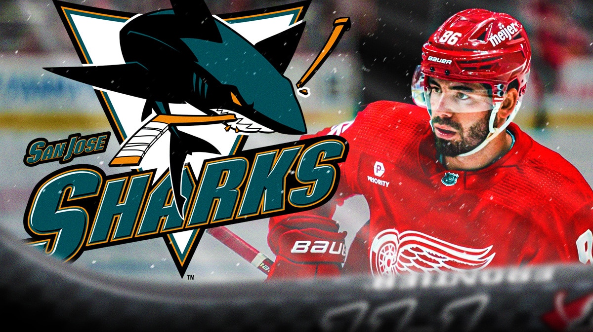 San Jose Sharks logo, next to Red Wings defenseman Jake Walman.