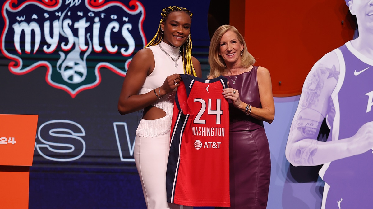 Aaliyah Edwards poses with WNBA commissioner Cathy Engelbert after she is selected with the number six overall pick to the Washington Mystics in the 2024 WNBA Draft.