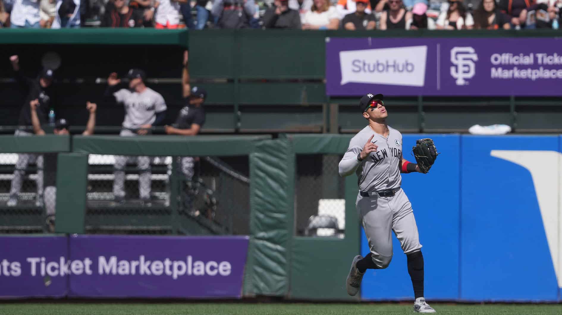 New York Yankees center fielder Aaron Judge (right) gestures after catching a fly ball for the last out of the game during the ninth inning against the San Francisco Giants at Oracle Park