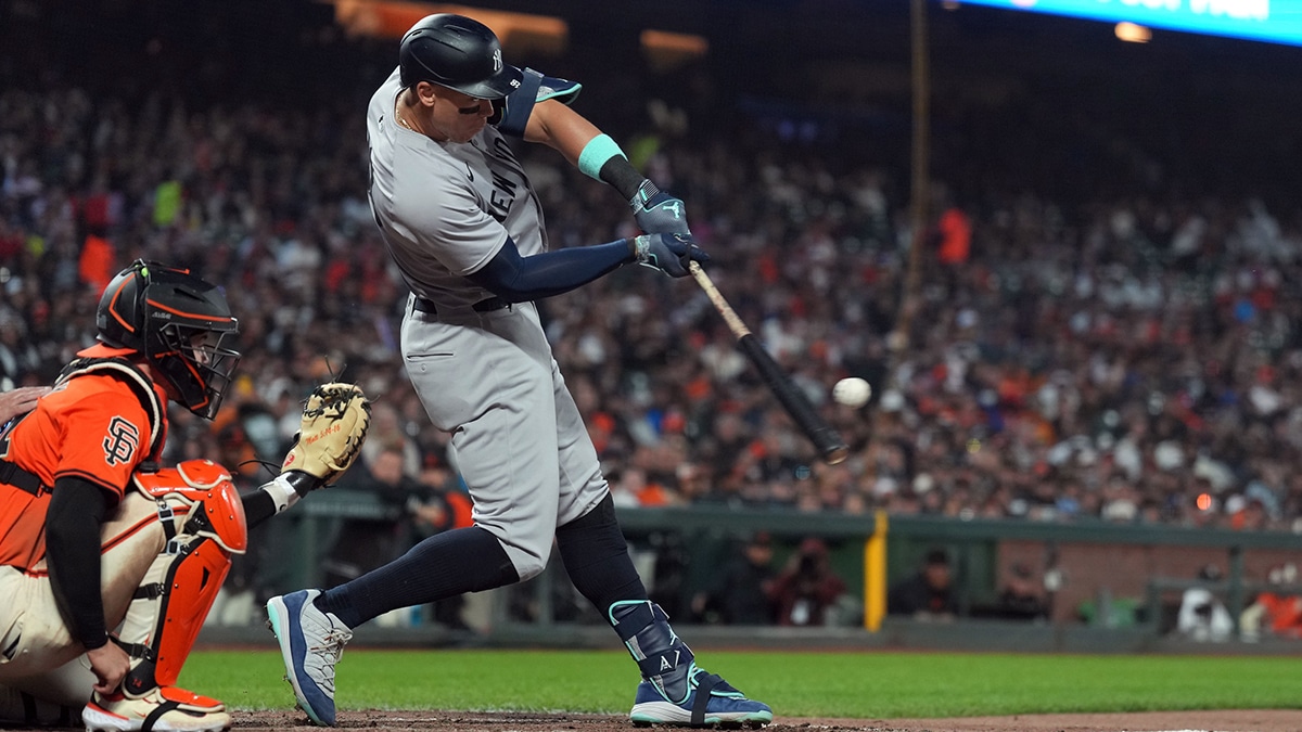 Yankees designated hitter Aaron Judge (center) hits a home run against the San Francisco Giants during the sixth inning at Oracle Park