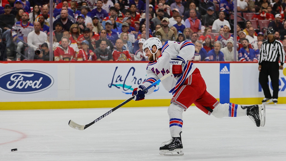 ; New York Rangers defenseman Adam Fox (23) shoots the puck against the Florida Panthers during the first period in game four of the Eastern Conference Final of the 2024 Stanley Cup Playoffs at Amerant Bank Arena