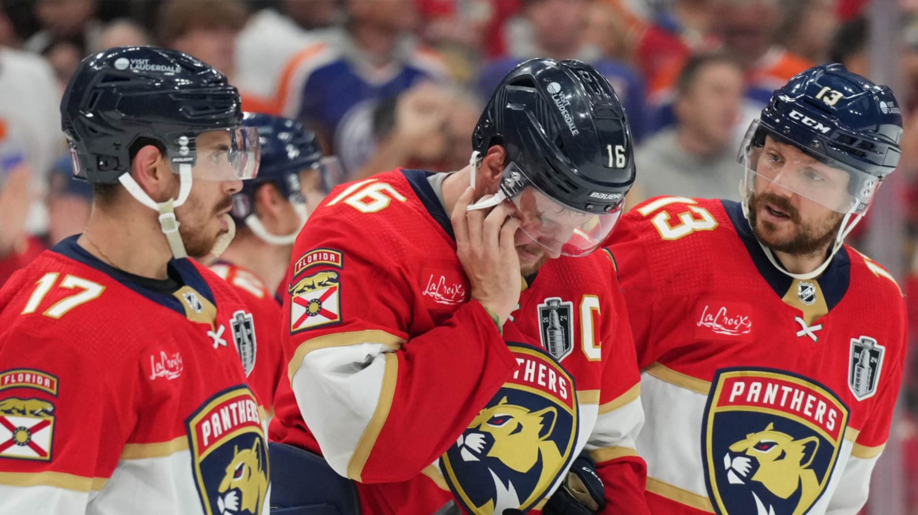Florida Panthers forward Aleksander Barkov (16) leaves the ice holding his jaw during the third period against the Edmonton Oilers in game two of the 2024 Stanley Cup Final at Amerant Bank Arena.