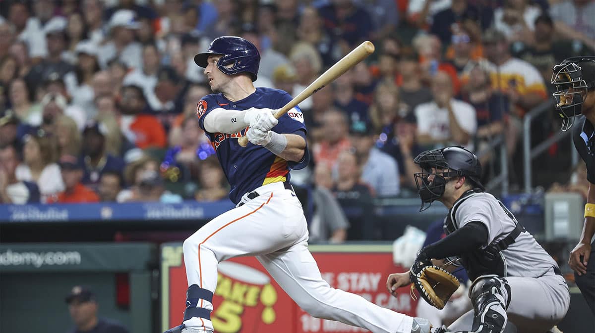 Houston Astros third baseman Alex Bregman (2) hits a single during the third inning against the New York Yankees at Minute Maid Park. 